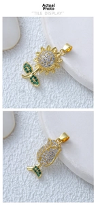 Detail of 18k gold plated sunflower and tulip pendants with green and white crystals