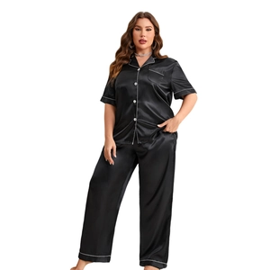 Classic black silk pajama set with short sleeve button top and long pants with white piping