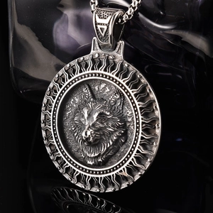 Macro shot of 3D viking wolf head round pendant necklace with antique silver finish