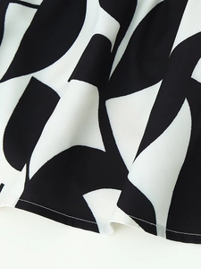 Slim fit printed dress with black and white geometric pattern and chiffon texture