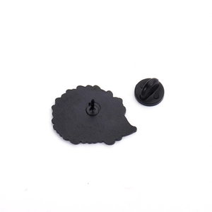 Black enamel pin back with rubber clutch showing cartoon character silhouette