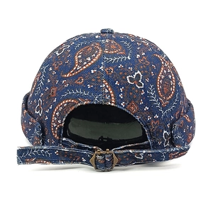 Vintage paisley pattern docker cap in navy blue with adjustable metal strap buckle