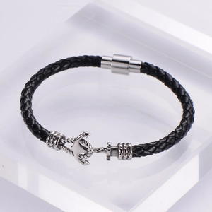 Men's black braided leather bracelet with silver anchor and magnetic clasp on stand