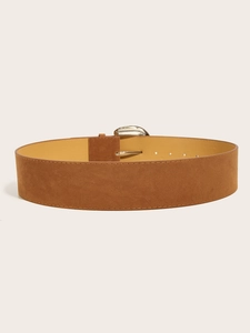 Close-up of brown suede wide belt featuring a textured finish and silver metal buckle