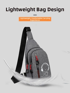 Close-up of lightweight grey chest bag featuring a white astronaut print and red zippers