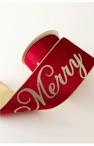 Macro detail of red velvet ribbon with gold Merry text and metallic wire edges