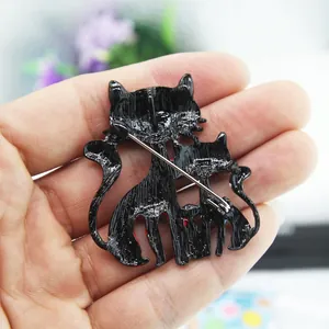 Three stacked black cat enamel pins made of alloy with a secure brooch pin back