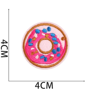 Detailed embroidery patch of a pink donut with 4cm diameter dimensions and sharp texture