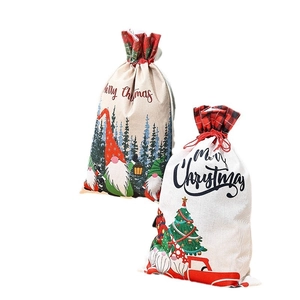 Christmas drawstring gift bags with gnome prints and red truck motifs on linen texture