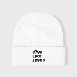 White knit beanie featuring bold black Love Like Jesus embroidery with a heart symbol