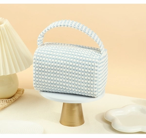 Blue and white plaid makeup bag featuring soft textured fabric and a sturdy top handle