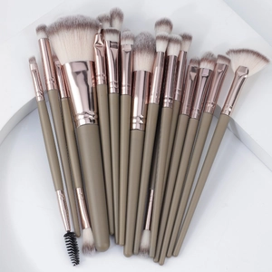 15-piece professional makeup brush set with green handles and rose gold tubes