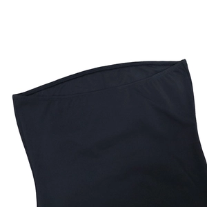 Detail of black strapless evening dress showing soft textile texture and double stitching