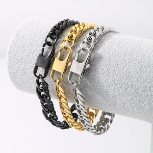 Close-up of hip hop Cuban link bracelets in gold silver and black with lobster clasps