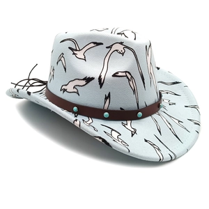 Detail of light blue western cowboy hat with bird print, leather band and turquoise studs