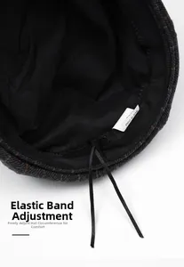 Detail view of adjustable inner elastic drawstring for comfort size on wool newsboy hat