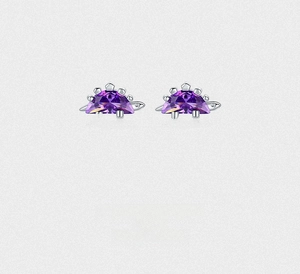 Detailed view of silver hedgehog stud earrings featuring purple zircon crystal accents