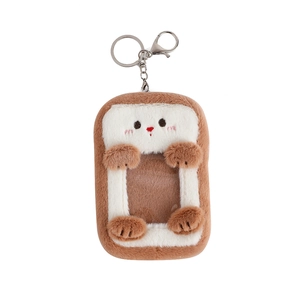 Detail of plush toast card holder with soft texture and metal lobster clasp attachment