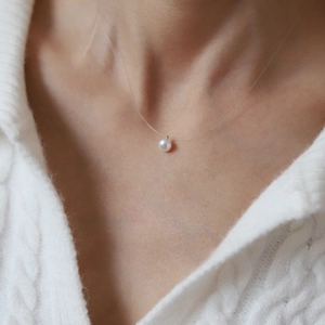 Minimalist single pearl invisible necklace with transparent line and silver clasp