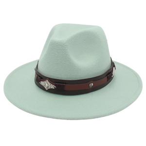 Detail of mint green wool felt fedora with vintage brown band and silver metal studs