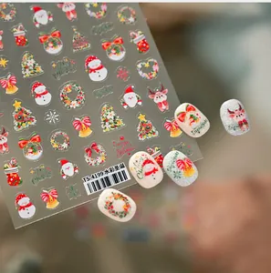 Macro detail of TS-4199 watercolor Christmas nail stickers with Santa and elk patterns