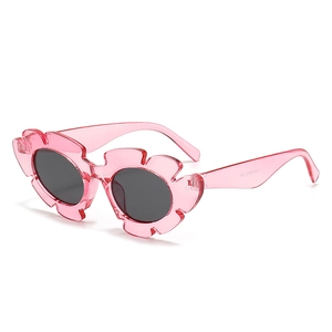 Flower shaped jelly pink sunglasses for women featuring stylish round dark gray lenses