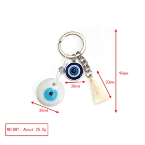 Detail view of pink Evil Eye keychain with glass beads and white tassel measurements