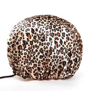 Detail of leopard print shower cap with waterproof PEVA lining and elastic satin finish