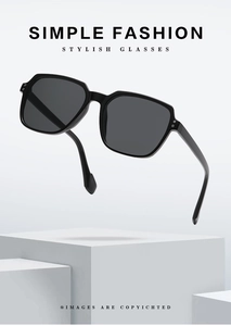 Detailed macro view of black oversized square sunglasses with stylish double rivet hinges