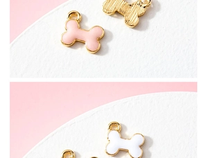 Detailed view of bone-shaped alloy pendants with colorful drip oil enamel finish