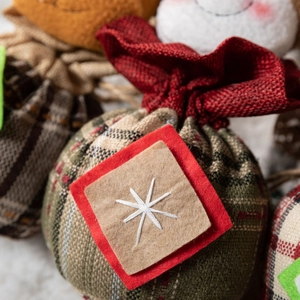 Christmas drawstring gift bags featuring festive plaid patterns and snowflake embroidery