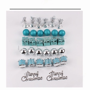 32-piece Christmas ornament set with silver and blue bells, gift boxes, and mini drums