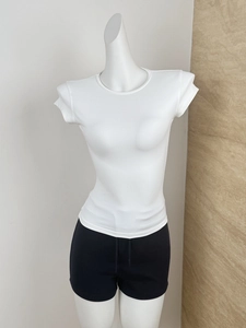 Detail of white ribbed crewneck short sleeve gym t-shirt on a female mannequin