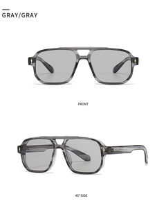 Front and 45-degree side views of gray aviator sunglasses with gold rivet accents