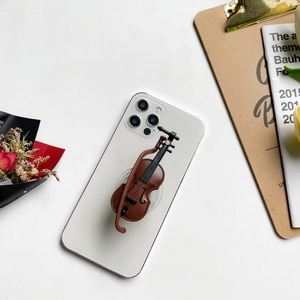 Detailed view of a creative cello-shaped folding phone grip stand on a white smartphone