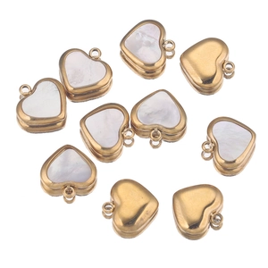 Macro shot of 11mm shell heart charms with gold stainless steel frames for DIY jewelry