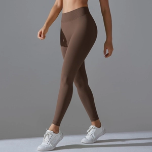 Detail of high-waisted seamless ribbed waistband on dark coffee yoga leggings
