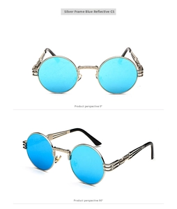 Detail view of steampunk round metal sunglasses with silver engraved frame and blue lenses