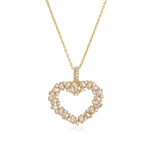 Detail of gold heart pendant necklace featuring sparkling baguette and round crystals