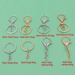 Detail of DIY heart keychain hardware set including lobster clasps and rings in gold and silver