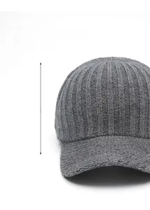 Detail of grey knitted baseball cap showing 13cm deep fit and thick ribbed wool texture