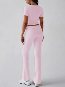 Rear view of pink Y2K crop top and high-waisted flared pants athletic set for women