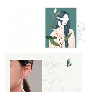 Detail view of heart-shaped silver earrings with pink inlay on a female model