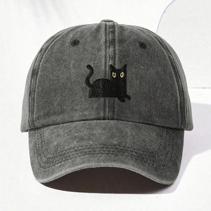 Gray washed denim baseball cap featuring an embroidered black cat with bright yellow eyes