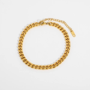Detailed view of the gold Cuban link anklet with lobster clasp and extension chain