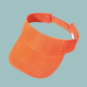 Detail of orange sun visor hat with adjustable hook and loop strap on blue background
