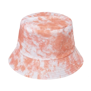 Women's orange and white tie-dye bucket hat with sun protection and cotton texture