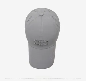 Detail of grey quick-dry baseball cap with CASUAL embroidery and laser-cut vents