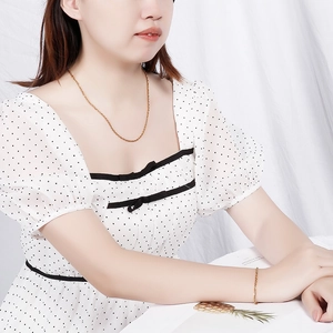 Minimalist 18k gold plated titanium steel chain necklace and bracelet set on model
