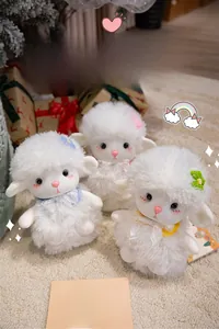 Detailed close-up of three plush lamb toys with fluffy texture and lace ribbon bows